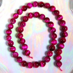 Perle Œil de tigre fushia 8 mm en pierre naturelle sur fil