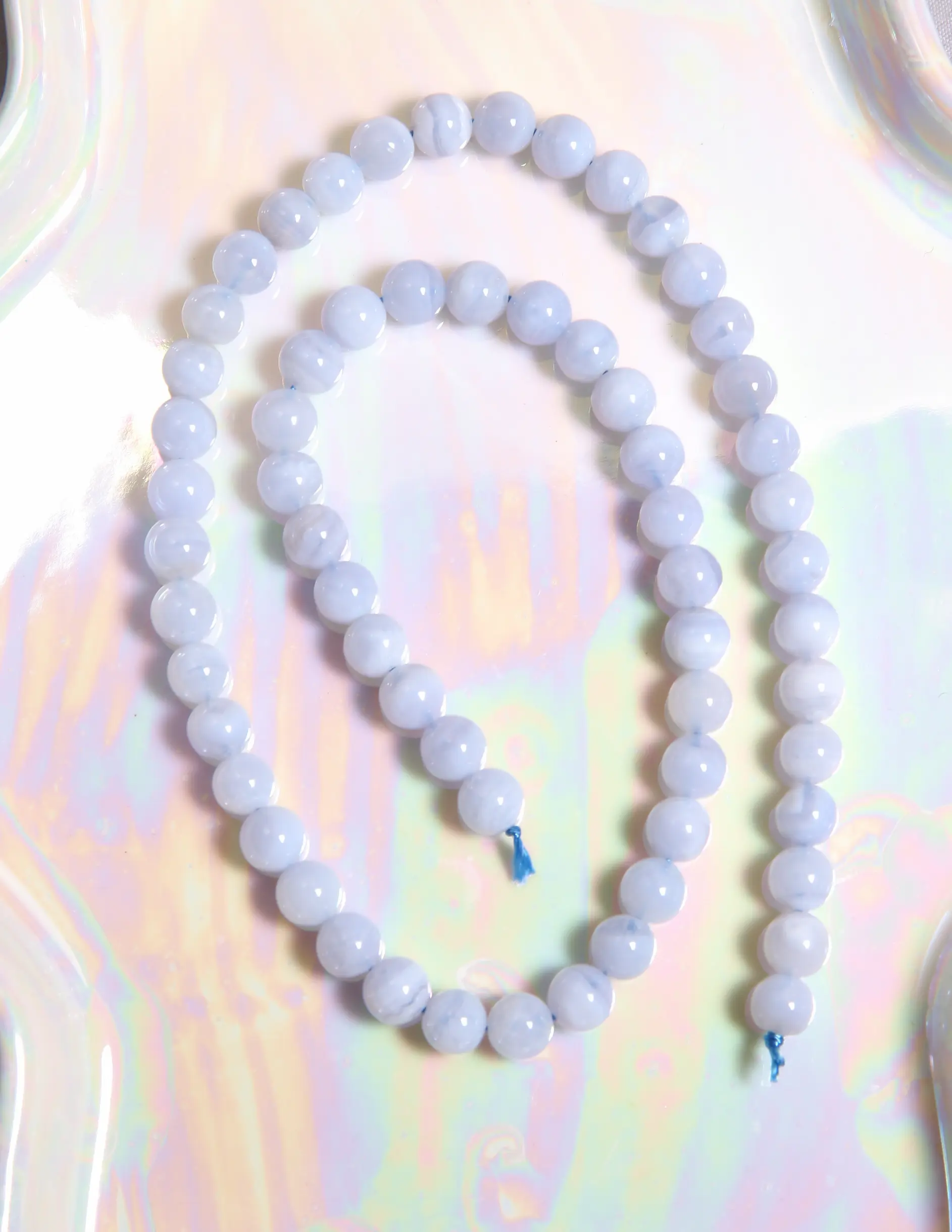 Perle calcédoine bleue 6 mm en pierre naturelle sur fil