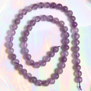 Perle Améthyste claire 6 mm en pierre naturelle sur fil