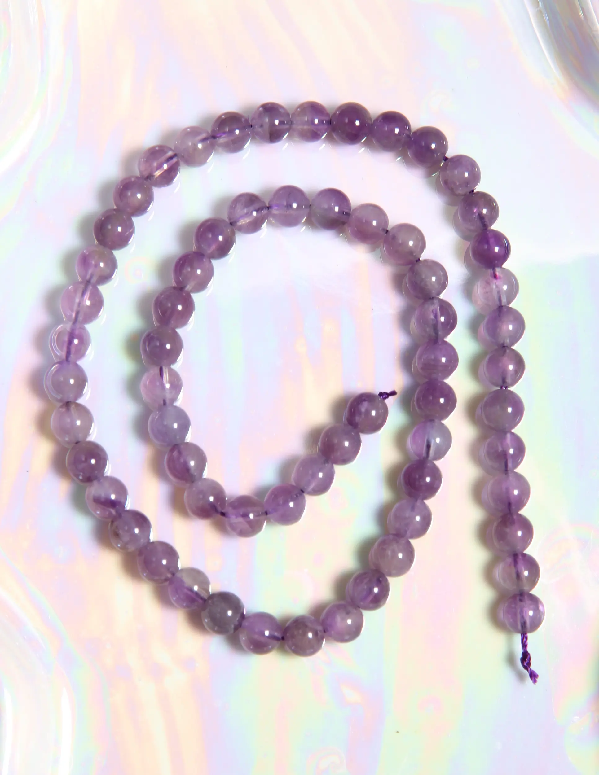 Perle Améthyste claire 6 mm en pierre naturelle sur fil