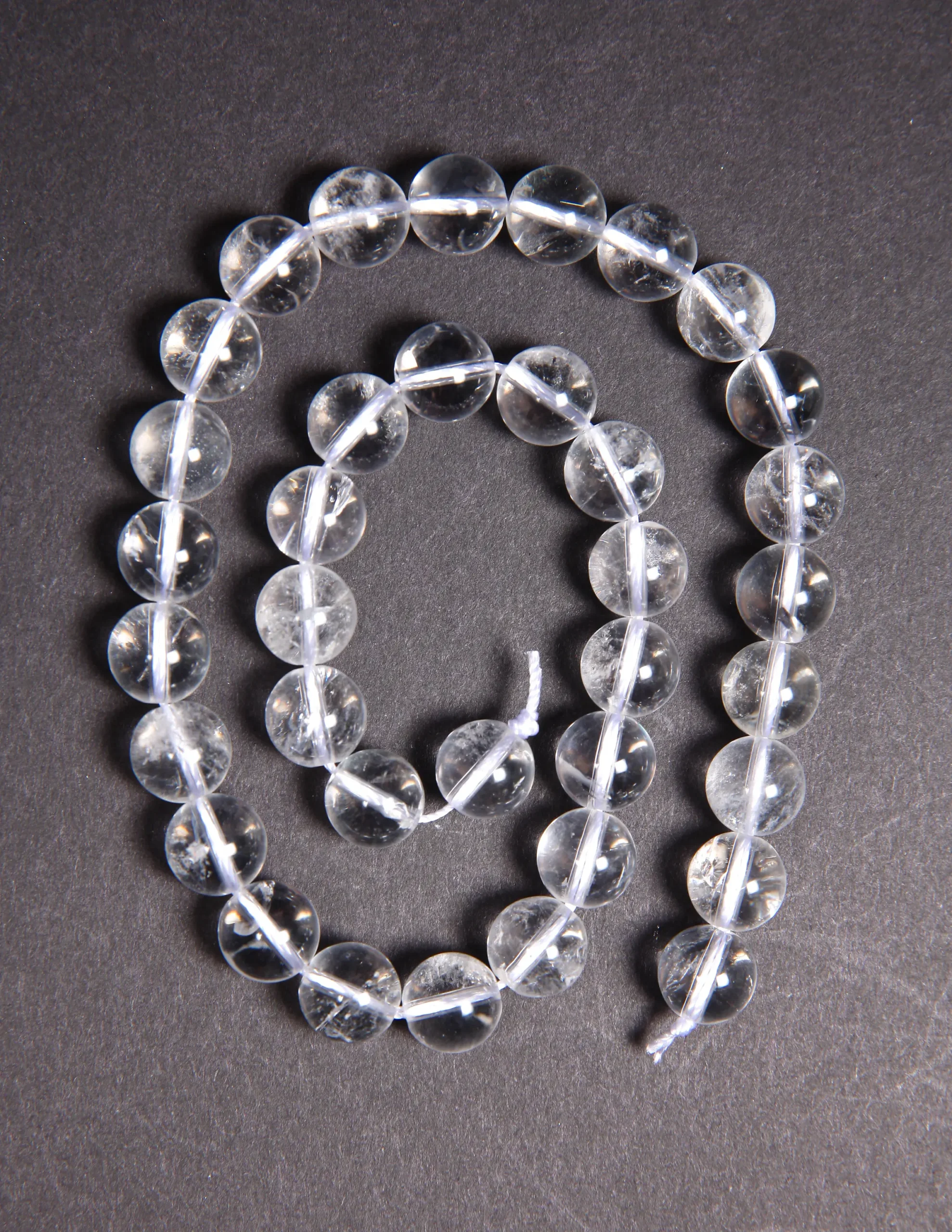 Perle cristal de roche 10mm en pierre naturelle sur fil